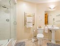 Ensuite bathroom with heated towel bars, blow dryer, bathrobes and slippers